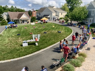 Photo of the Village Green during a Cornhole Tournament